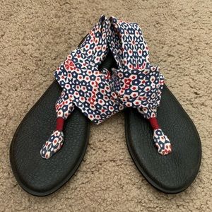 Red, white, and blue Sanuk yoga slings